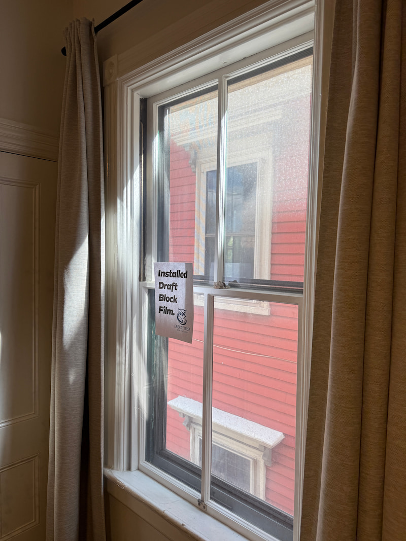 Window with clear insulation film installed, looking nearly invisible