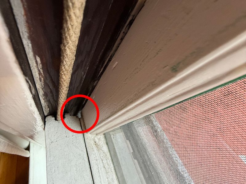 Window with visible gap showing cold air infiltration